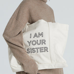 Tote bag with embroidered statement sayin I AM YOUR SISTER 
